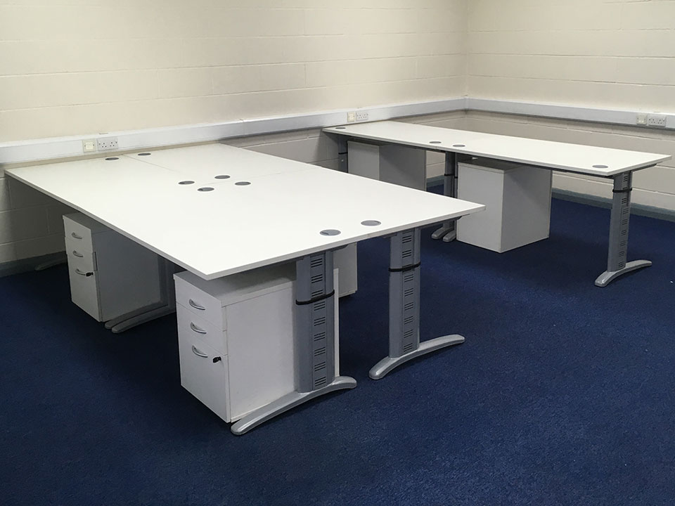 Used white workstations with mobile pedestals.
